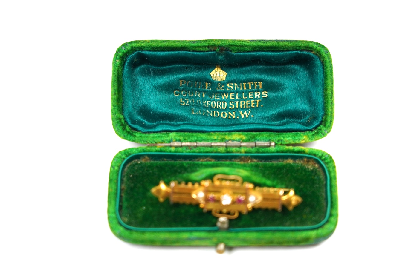 A late Victorian yellow metal (stamped 15), ruby, diamond and seed pearl set bar brooch, 46mm, gross weight 4.2 grams. Condition - fair